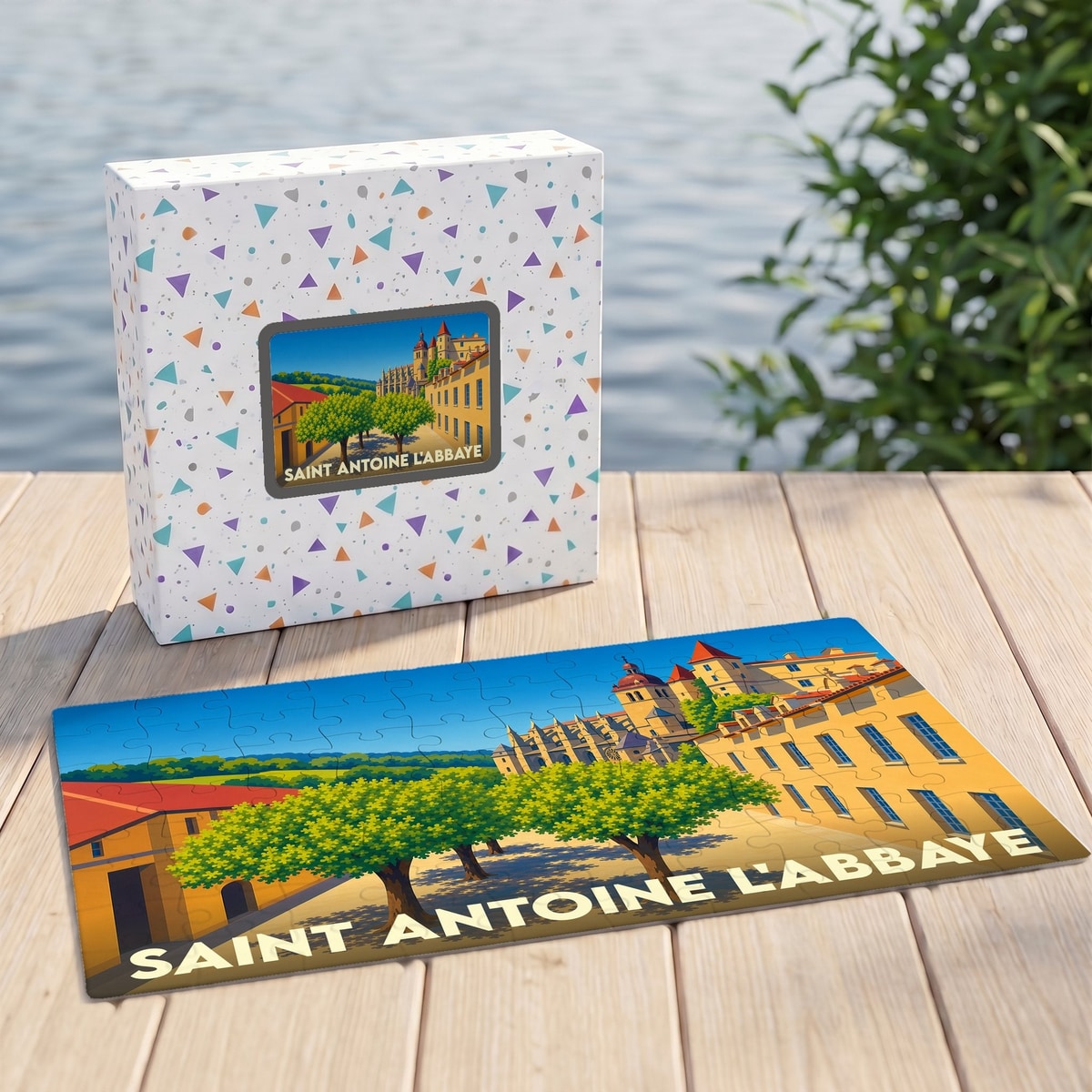 Puzzle souvenir de Saint-Antoine-l'Abbaye présentant une illustration stylisée du village et de son abbaye.