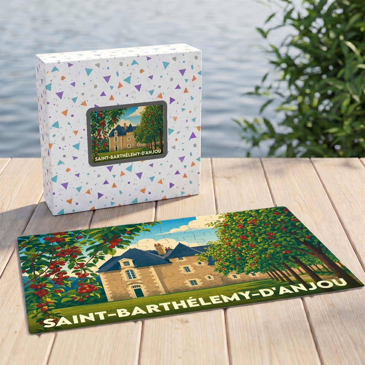 Puzzle souvenir de Saint-Barthélemy-d'Anjou illustrant un manoir entouré de cerisiers.
