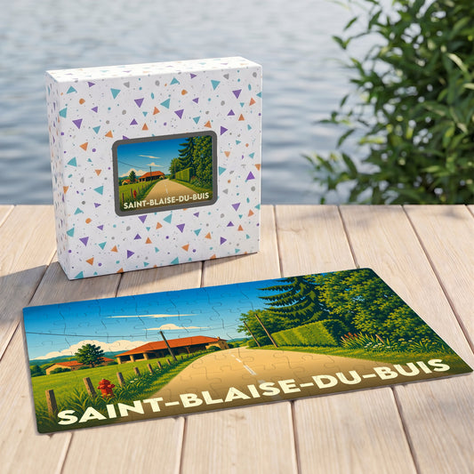 Puzzle souvenir de la ville de Saint-Blaise-du-Buis avec une illustration stylisée d'un paysage rural.