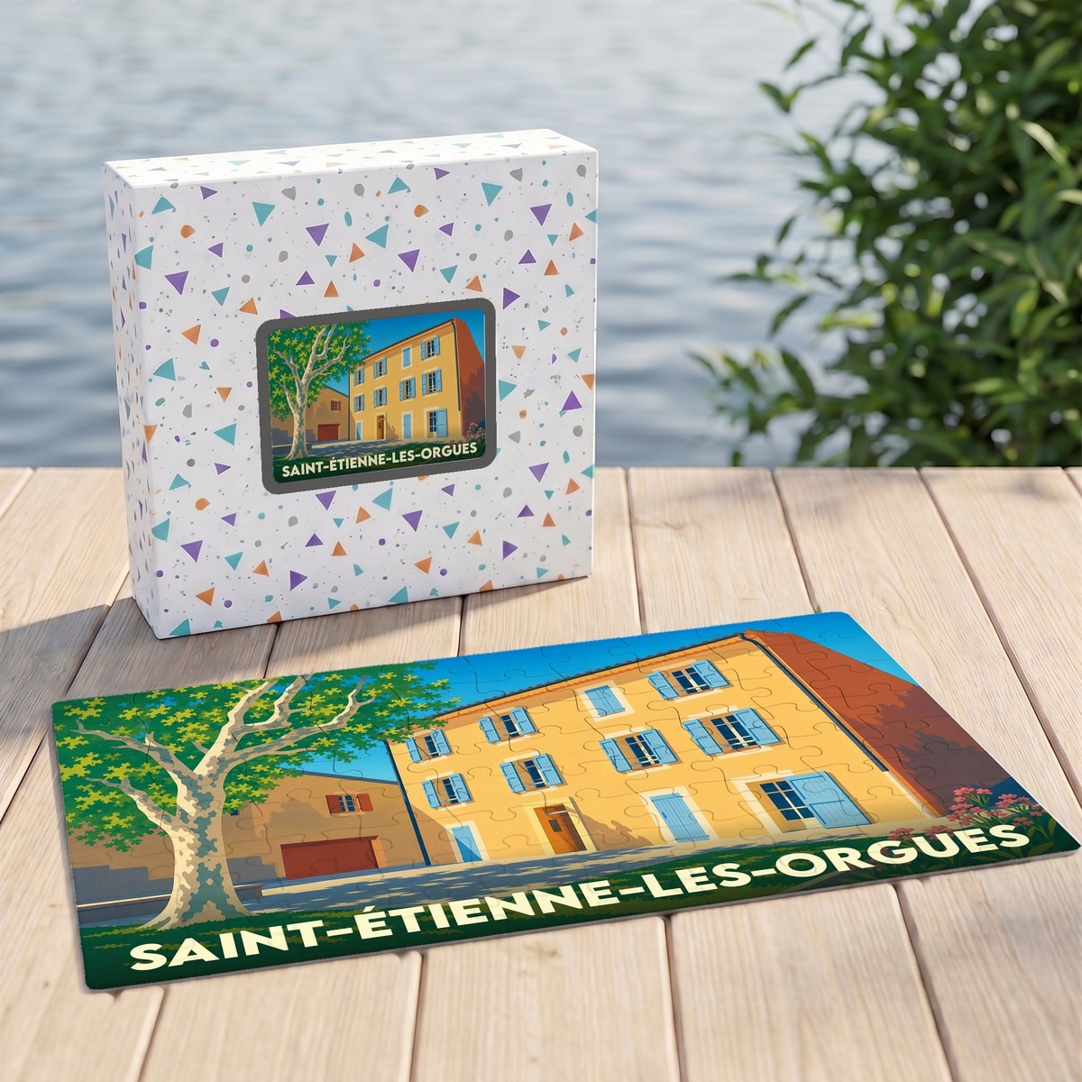 Puzzle souvenir de la ville de Saint-Étienne-les-Orgues avec une illustration stylisée d'une maison provençale et d'un platane.