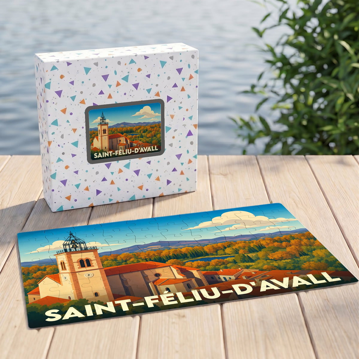 Puzzle souvenir de la ville de Saint-Féliu-d'Avall avec une illustration stylisée de son église et de ses paysages.