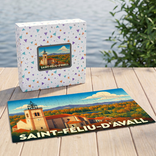 Puzzle souvenir de la ville de Saint-Féliu-d'Avall avec une illustration stylisée de son église et de ses paysages.