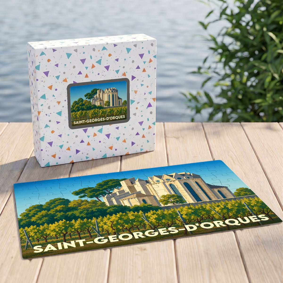 Puzzle souvenir de la ville de Saint-Georges-d'Orques avec une illustration stylisée d'un domaine viticole.