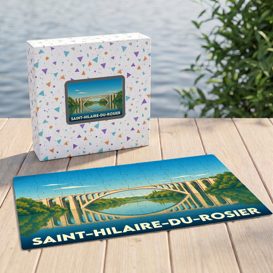 Puzzle souvenir de la ville de Saint-Hilaire-du-Rosier illustrant un pont se reflétant dans l'eau.