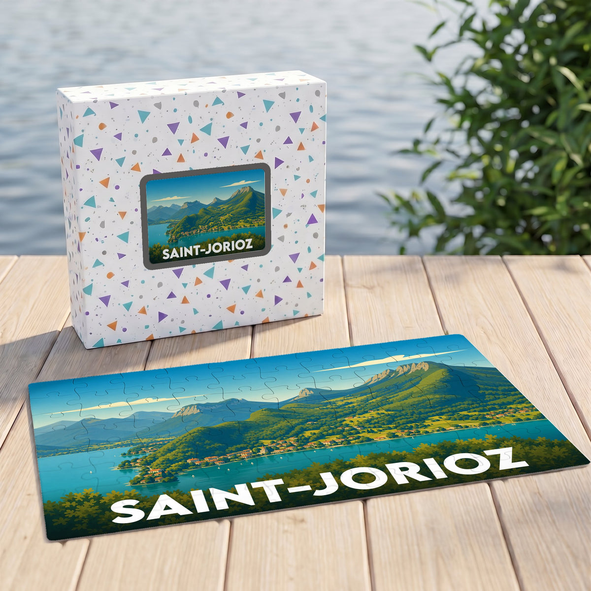 Puzzle souvenir de la ville de Saint-Jorioz avec une illustration panoramique stylisée du lac et des montagnes.