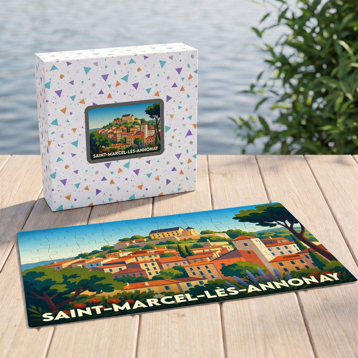 Puzzle souvenir de la ville de Saint-Marcel-lès-Annonay avec une illustration stylisée d'un village perché.