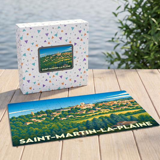 Puzzle souvenir de la ville de Saint-Martin-la-Plaine avec son coffret illustré d'un paysage stylisé.