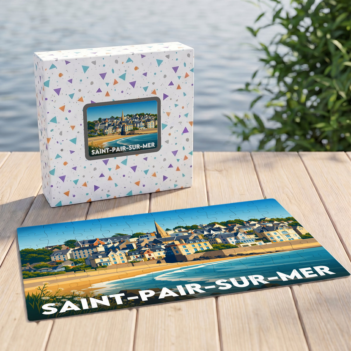 Puzzle souvenir de la ville de Saint-Pair-sur-Mer avec son illustration balnéaire stylisée et sa boîte assortie.
