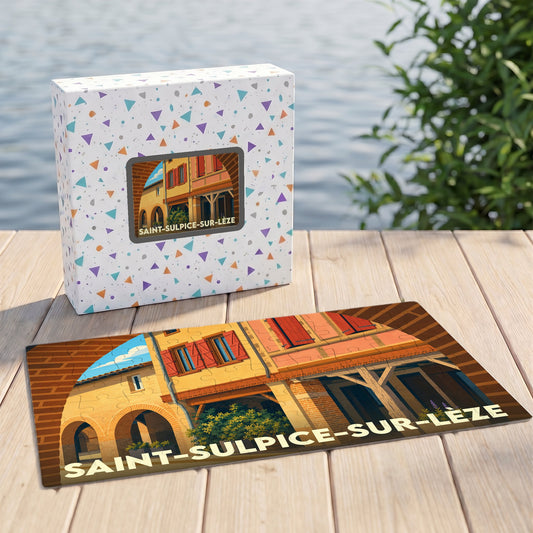 Puzzle souvenir de la ville de Saint-Sulpice-sur-Lèze avec une illustration stylisée de son architecture traditionnelle.
