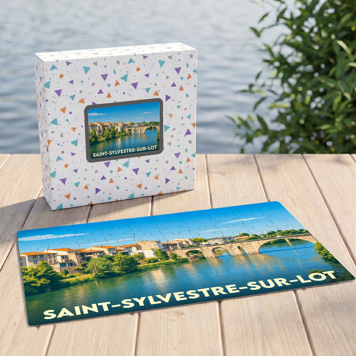 Puzzle souvenir de la ville de Saint-Sylvestre-sur-Lot avec une illustration de son pont et de ses quais.