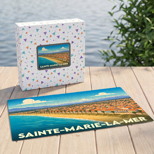 Puzzle souvenir de la ville de Sainte-Marie-la-Mer avec une illustration stylisée du bord de mer.