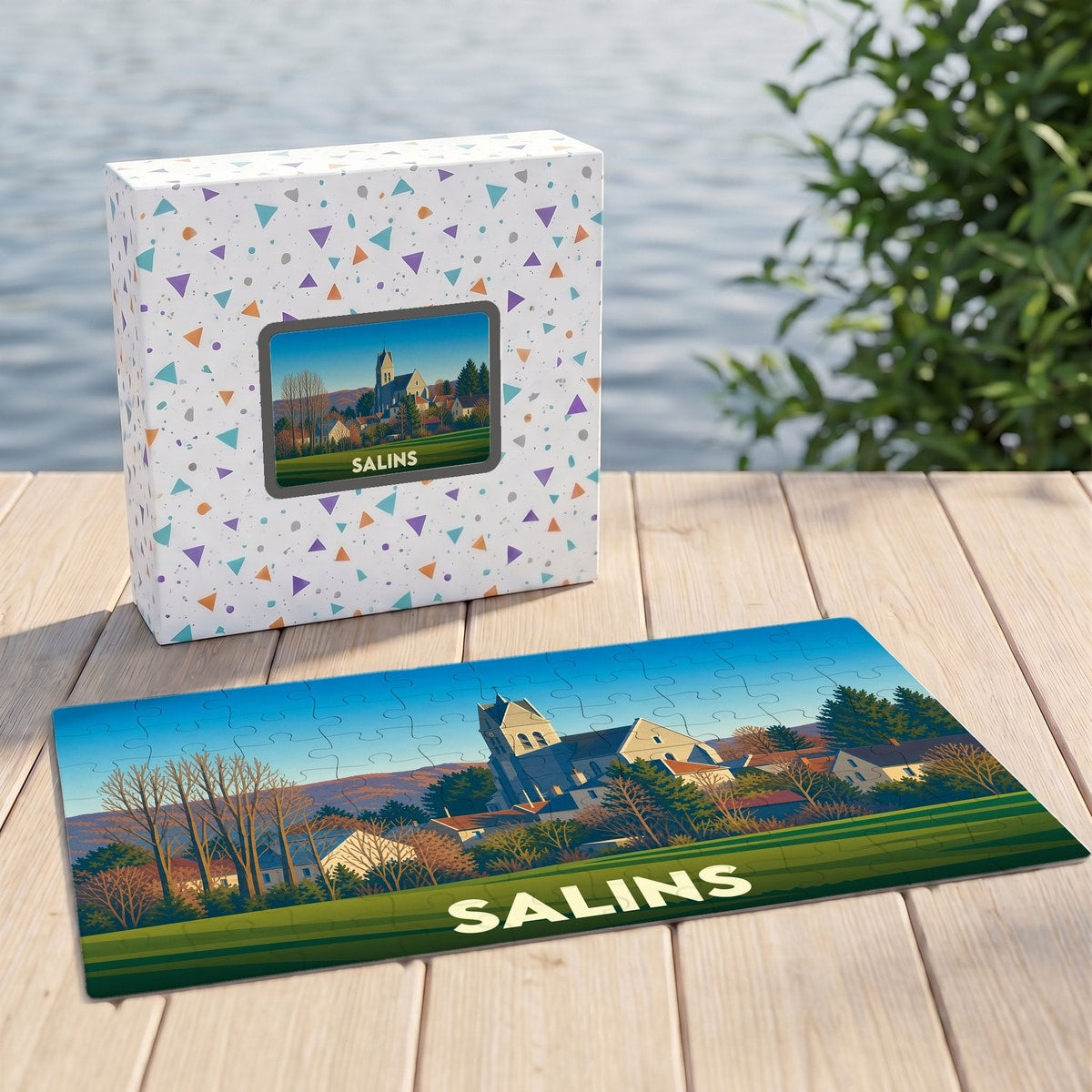 Puzzle souvenir de la ville de Salins avec une illustration stylisée de son église et ses paysages.