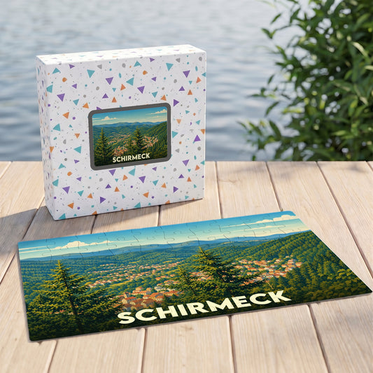 Puzzle souvenir de la ville de Schirmeck avec une illustration de son paysage verdoyant.