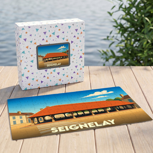 Puzzle souvenir de la ville de Seignelay avec une illustration stylisée d'une halle couverte.