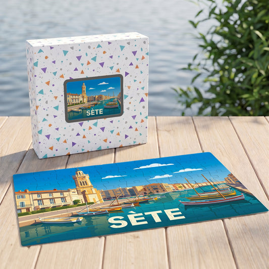 Puzzle souvenir de la ville de Sète accompagné de sa boîte, présentant une illustration stylisée de son port et de ses canaux.