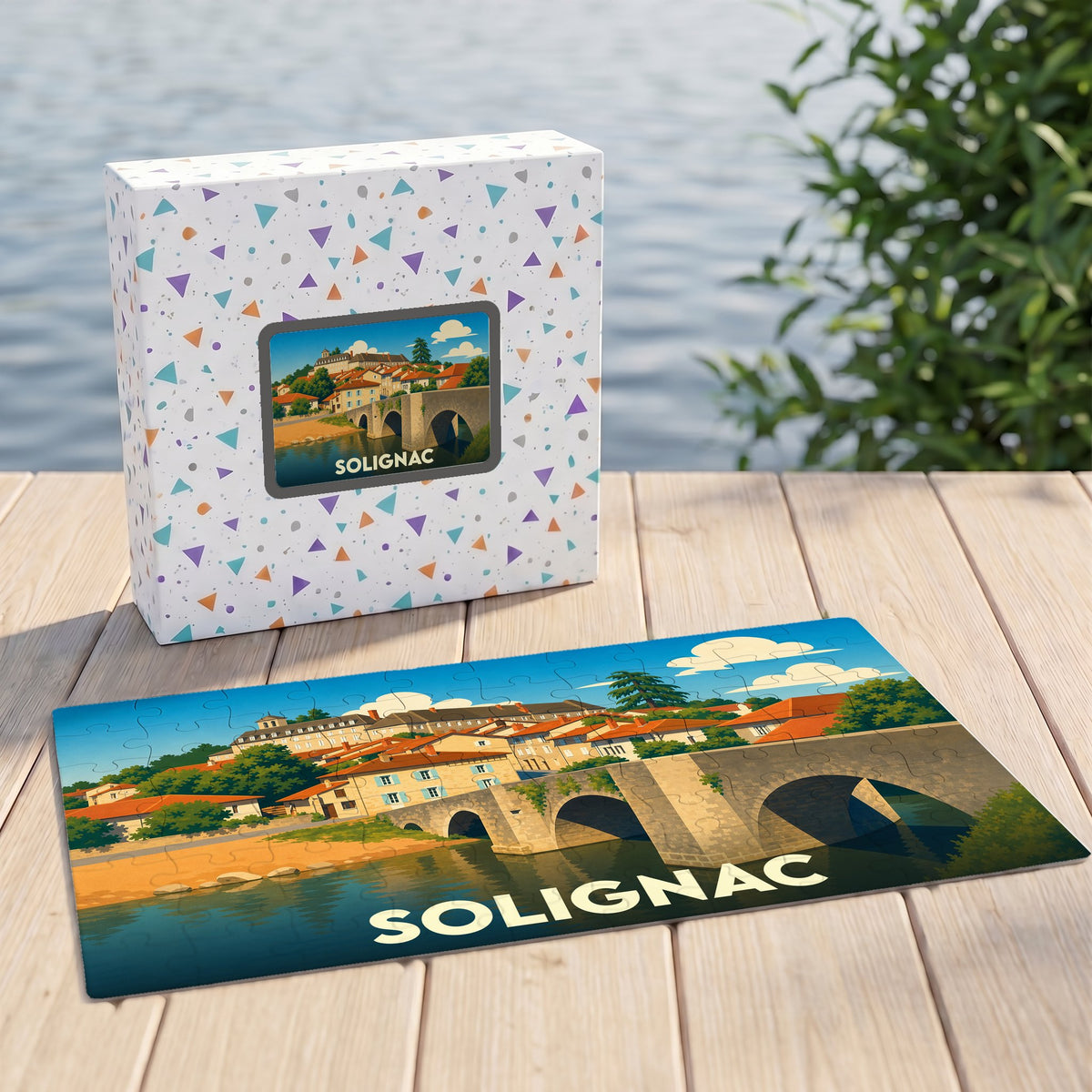 Puzzle souvenir de la ville de Solignac avec une illustration stylisée de son pont et de ses maisons anciennes.