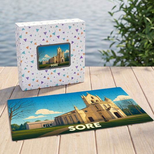 Puzzle souvenir de la ville de Sore avec une illustration stylisée de son église.