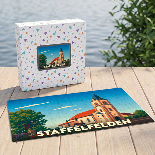 Puzzle souvenir de la ville de Staffelfelden avec une illustration stylisée de son église.