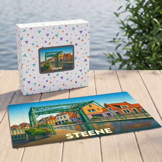 Puzzle souvenir de la ville de Steene avec une illustration colorée d'un pont et de maisons flamandes.