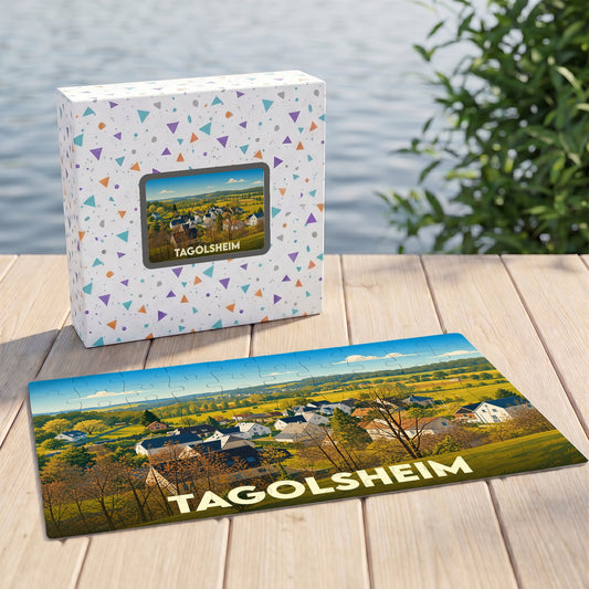 Puzzle souvenir de la ville de Tagolsheim avec une illustration stylisée d'un paysage champêtre.