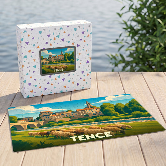 Puzzle souvenir de la ville de Tence illustrant un paysage champêtre stylisé avec son église et un troupeau de moutons.