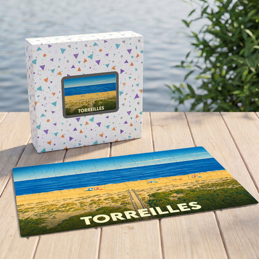 Puzzle souvenir de la ville de Torreilles avec une illustration stylisée de sa plage sauvage.