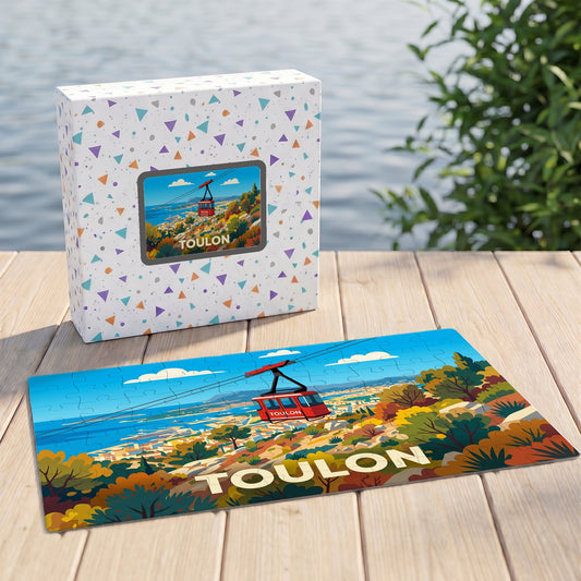 Puzzle souvenir de la ville de Toulon représentant le téléphérique surplombant la côte dans un style illustré.