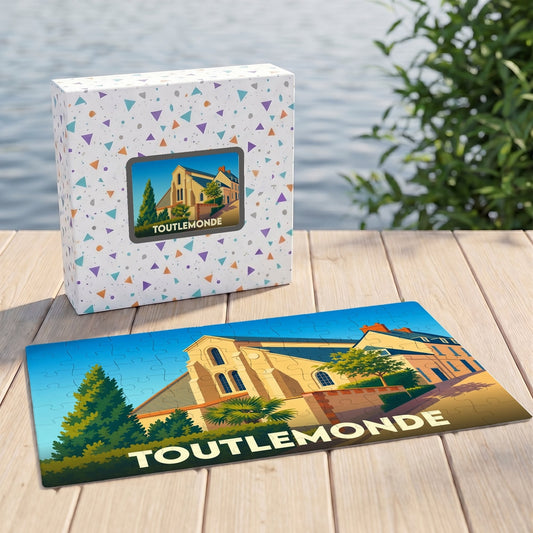 Puzzle souvenir de la ville de Toutlemonde avec une illustration stylisée d'un bâtiment historique.