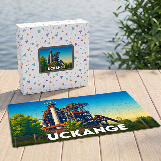 Puzzle souvenir de la ville d'Uckange avec une illustration stylisée d'un haut-fourneau.