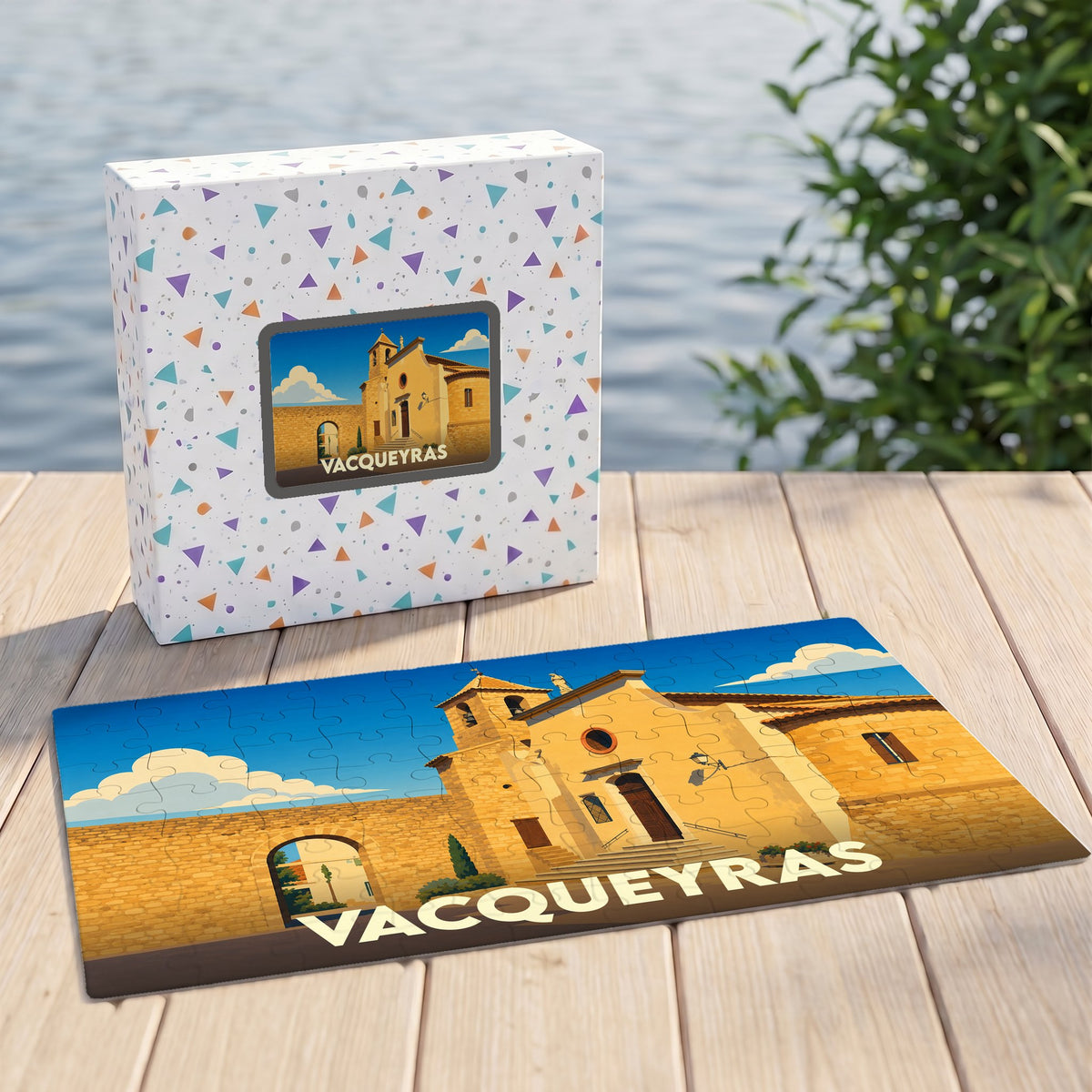 Puzzle souvenir de la ville de Vacqueyras avec une illustration stylisée et sa boîte assortie.