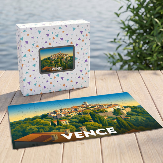 Puzzle souvenir de la ville de Vence avec une illustration stylisée des toits et de la colline.