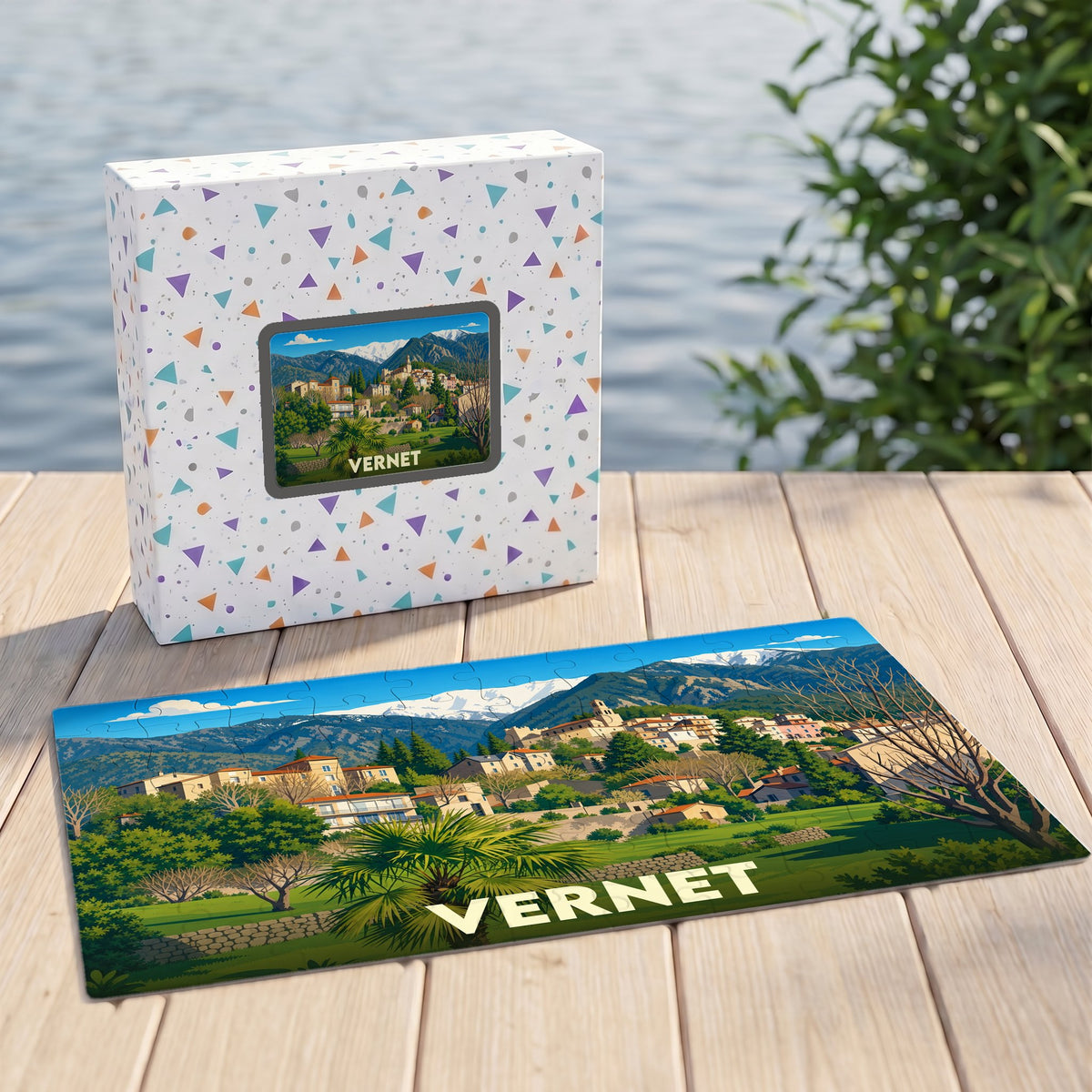 Puzzle souvenir de la ville de Vernet présentant une illustration paysagère stylisée.