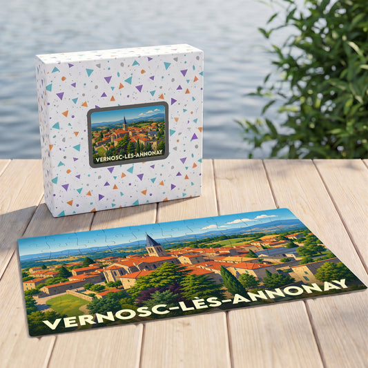 Puzzle souvenir de la ville de Vernosc-lès-Annonay illustrant un paysage de village vallonné.