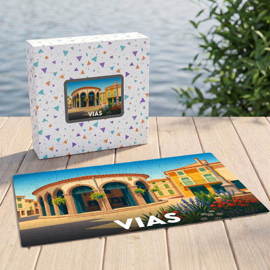 Puzzle souvenir de la ville de Vias illustrant un bâtiment historique coloré sous forme de dessin stylisé.