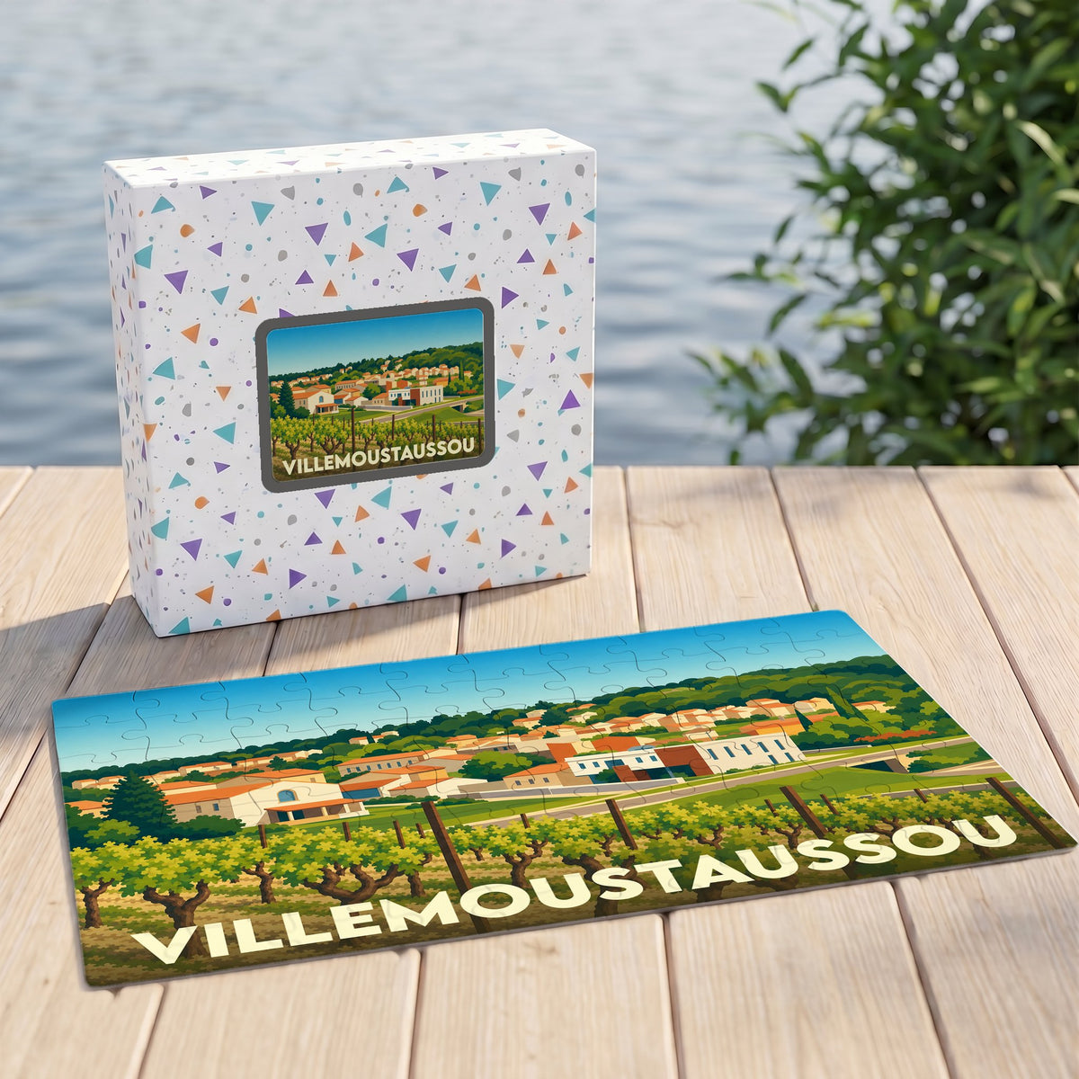 Puzzle souvenir de la ville de Villemoustaussou avec une illustration colorée d'un paysage de vignobles.