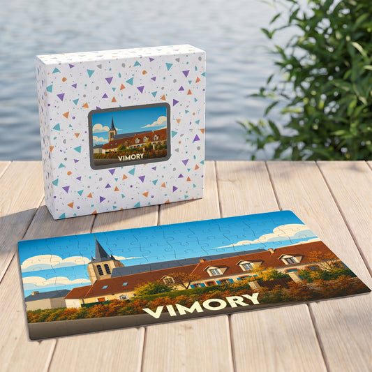 Puzzle souvenir de la ville de Vimory avec une illustration stylisée de son église et de ses maisons.