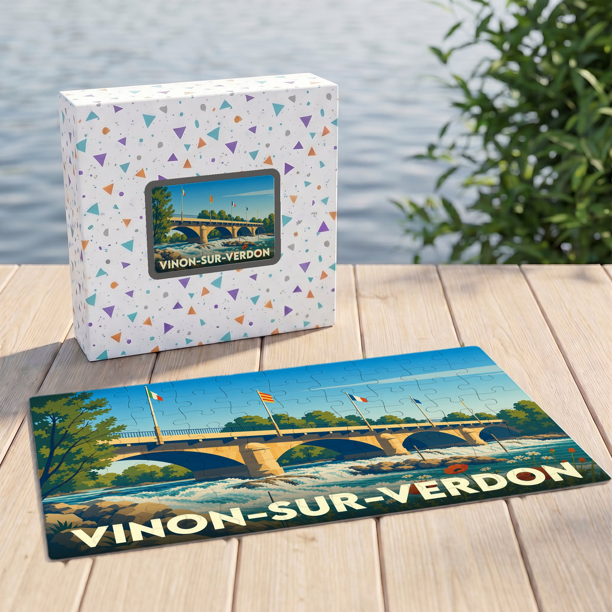 Puzzle souvenir de la ville de Vinon-sur-Verdon avec une illustration stylisée de son pont et de sa rivière.