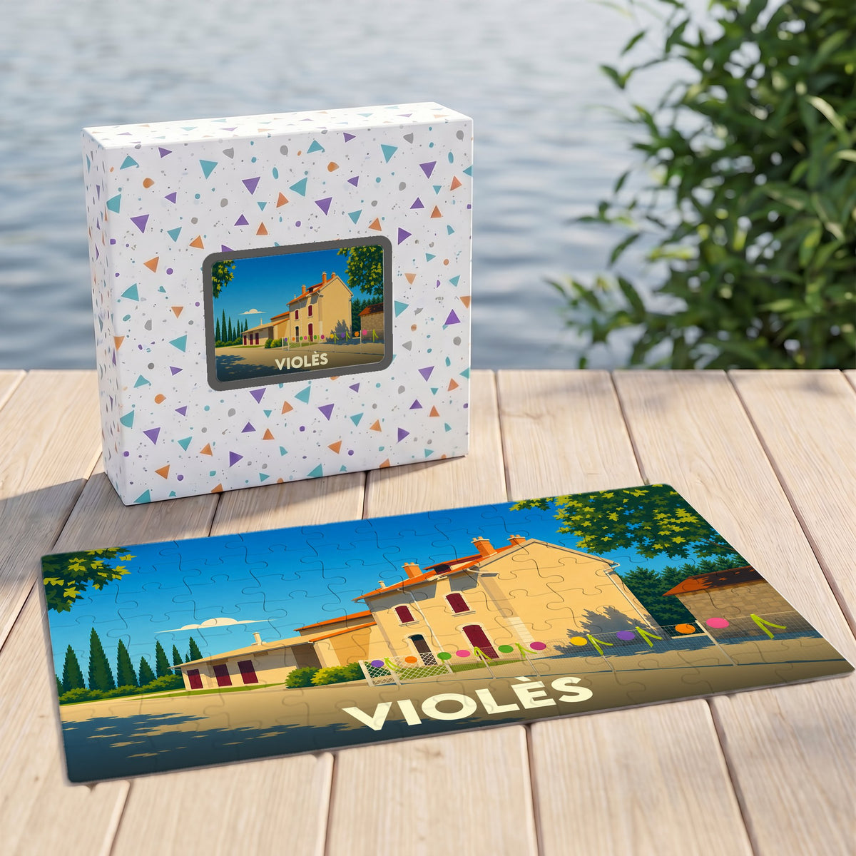 Puzzle souvenir de la ville de Violès avec une illustration stylisée d'un bâtiment provençal.