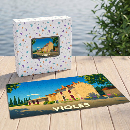Puzzle souvenir de la ville de Violès avec une illustration stylisée d'un bâtiment provençal.