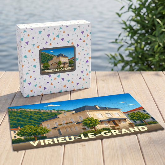 Puzzle souvenir de la ville de Virieu-le-Grand avec son coffret illustré d'un paysage stylisé.