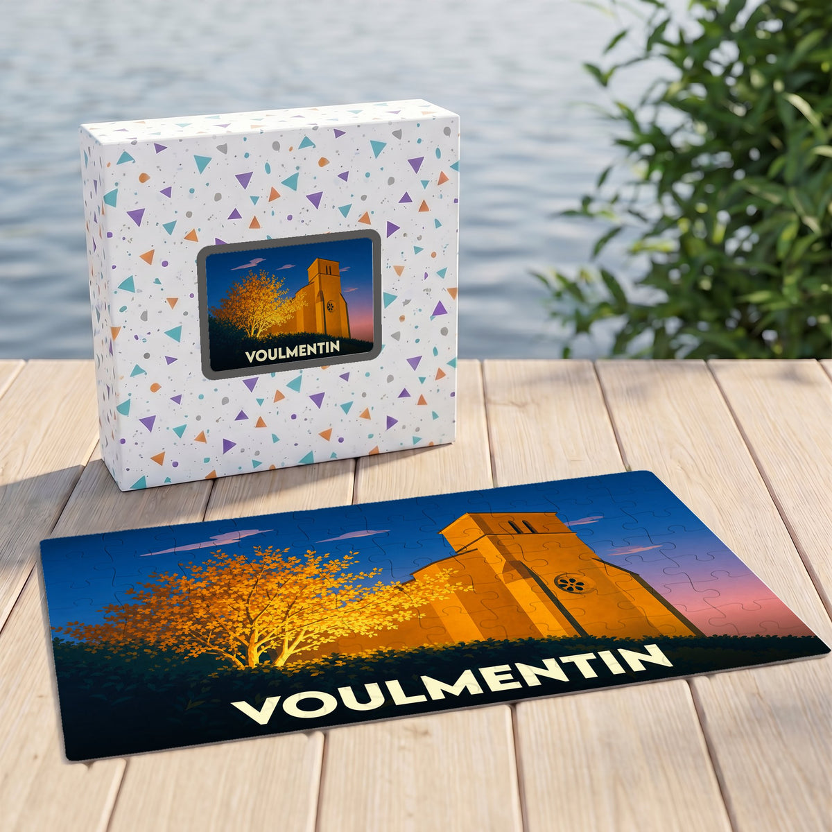 Puzzle souvenir de la ville de Voulmentin avec une illustration stylisée d'un monument au coucher du soleil.