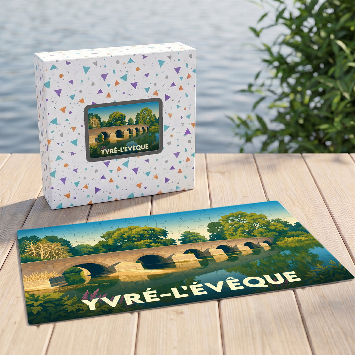 Puzzle souvenir de la ville d'Yvré-l'Évêque avec une illustration stylisée d'un pont en pierre.