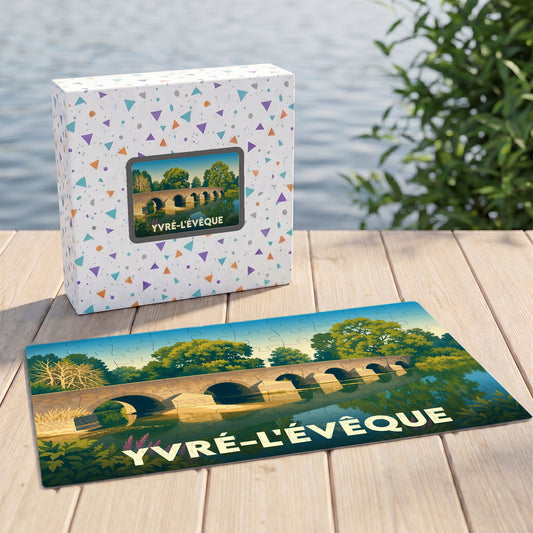 Puzzle souvenir de la ville d'Yvré-l'Évêque avec une illustration stylisée d'un pont en pierre.