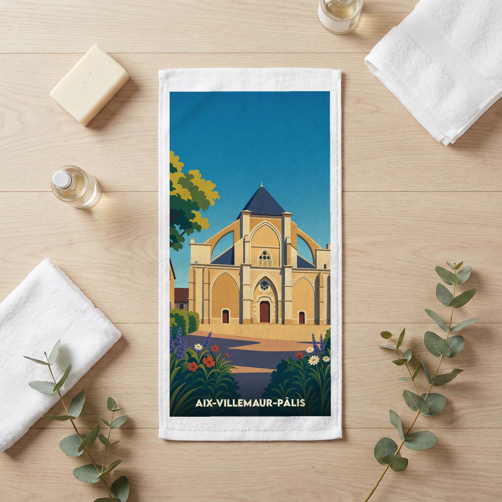 Serviette de bain souvenir de la ville d'Aix-Villemaur-Pâlis avec une illustration stylisée de son église collégiale.