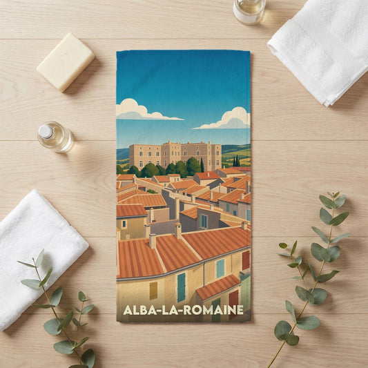 Serviette de bain souvenir de la ville d'Alba-la-Romaine avec une illustration stylisée de ses toits et de son château.