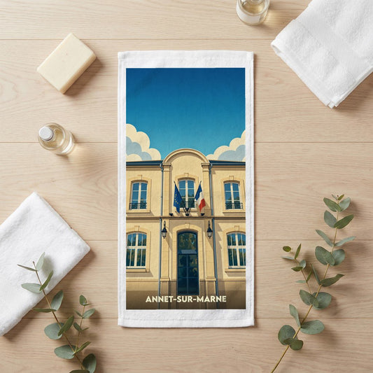 Serviette de bain souvenir de la ville d'Annet-sur-Marne avec une illustration stylisée de sa mairie.