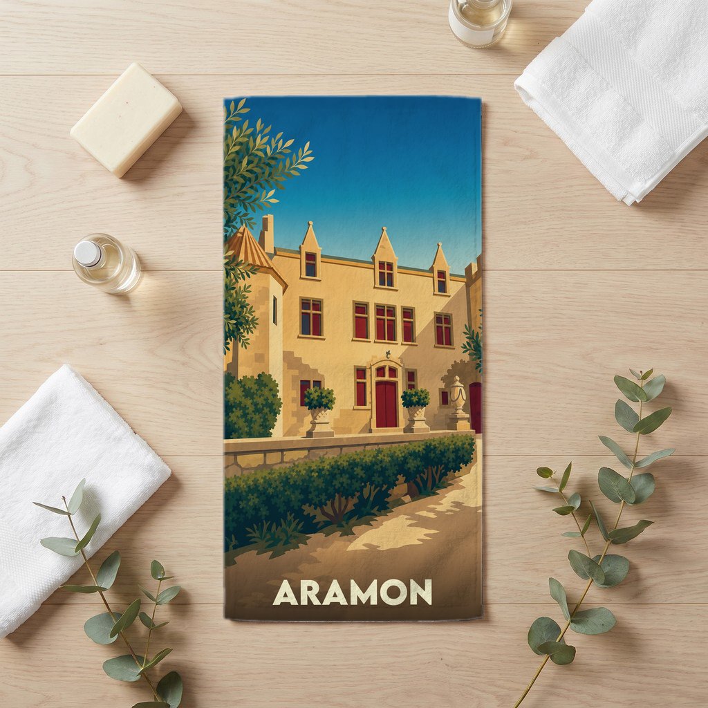 Serviette de bain souvenir de la ville d'Aramon avec une illustration stylisée de son château.