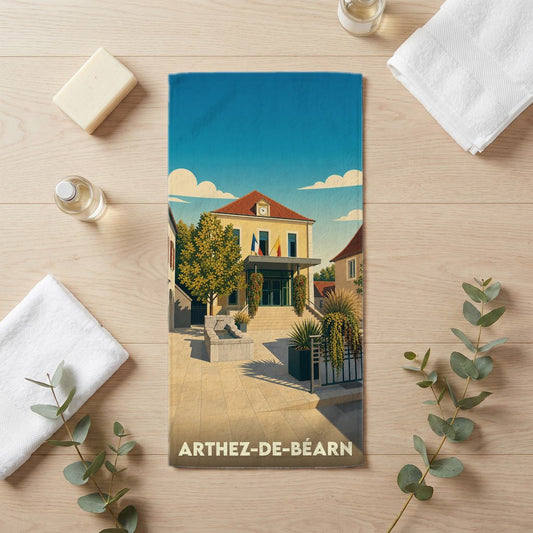 Serviette de bain souvenir de la ville de Arthez-de-Béarn avec une illustration stylisée de sa mairie.