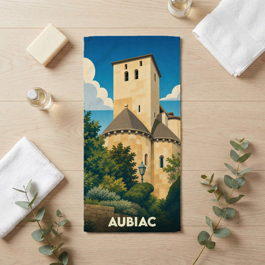 Serviette de bain souvenir de la ville d'Aubiac illustrée d'un château médiéval de style vintage.