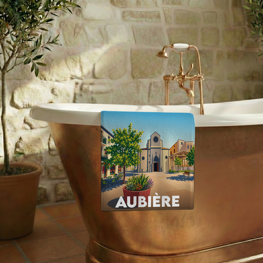 Serviette de bain souvenir de la ville d’Aubière avec une illustration stylisée.